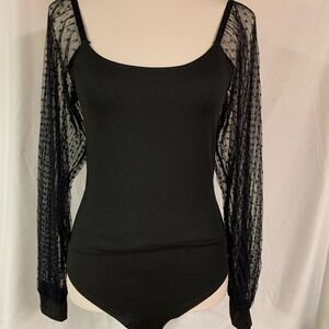 Black bodysuit, sheer sleeves with black polka dots. Size M